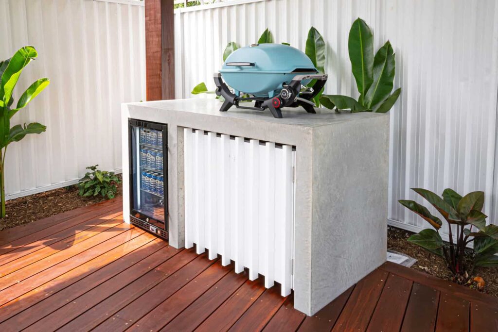 Sovereign Landscape Design Project Mermaid Waters - custom concrete bbq area with mini fridge