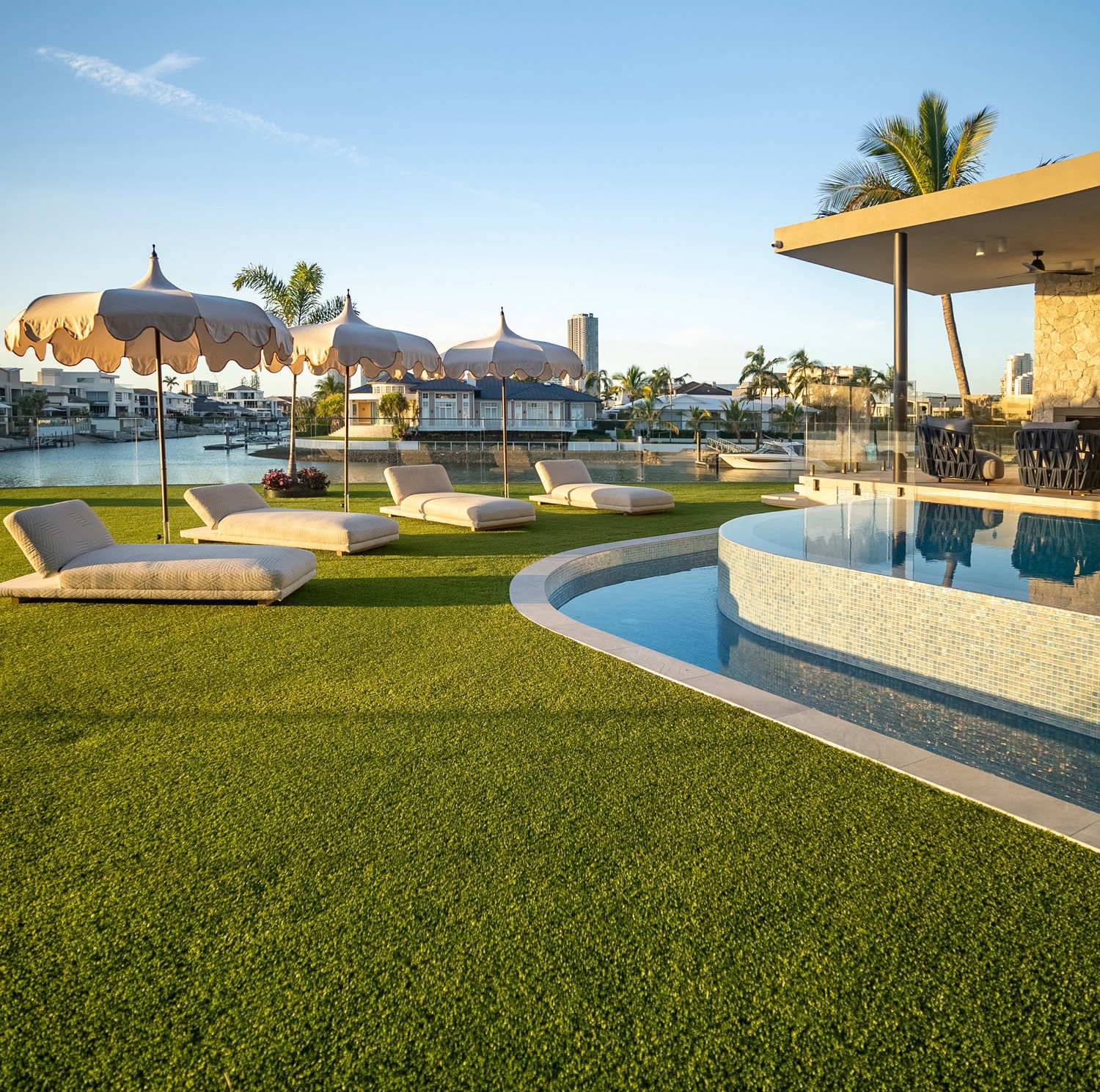 Landscape design project in Paradise Waters - artificial turf, poolside beds